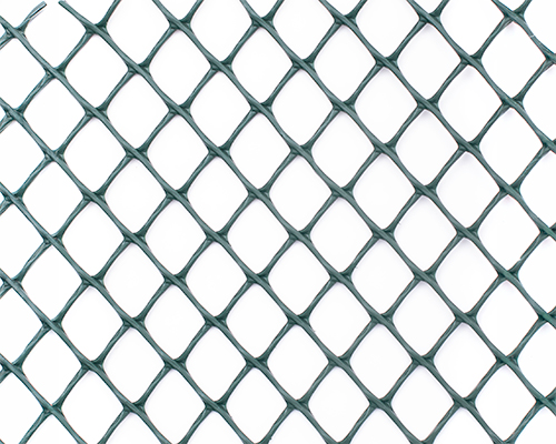 Extreme close-up of Tenax Turf Reinforcement HDPE mesh showing the rhomboidal aperture pattern and structure