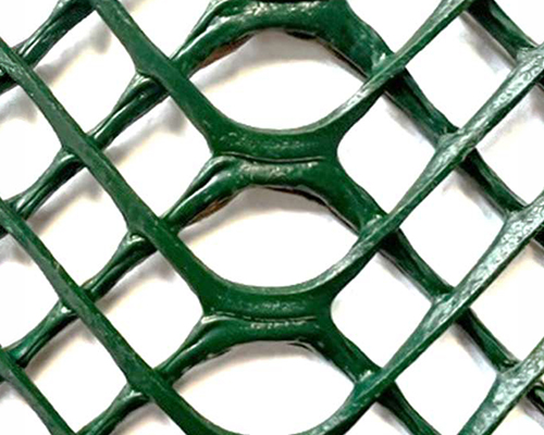 Close-up of Tenax GP Flex ground protection mesh showing the large rounded rectangular cell structure and robust HDPE construction