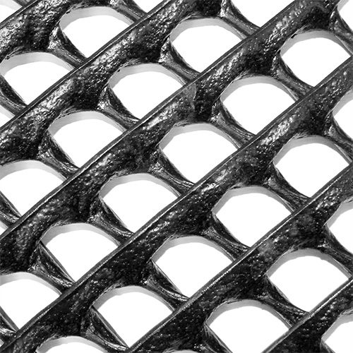 Close-up of Tenax Trackway HDPE ground protection mat showing the large rounded square grid cell pattern and heavy-duty black construction