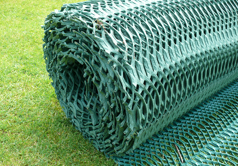 End-on view of a Tenax GP Flex ground protection mesh roll showing the roll construction, HDPE gauge and green coloring