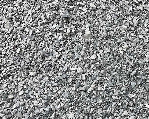 Close-up of compacted grey gravel surface as a comparison alternative to Tenax ground protection mesh for high-traffic areas
