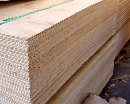 Stack of plywood sheets used as a comparison alternative to Tenax Trackway ground protection mats at construction sites