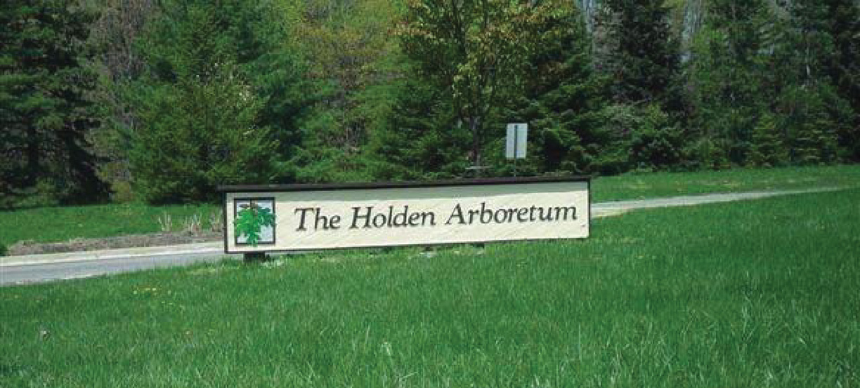 The Holden Arboretum entrance sign on a Tenax mesh-reinforced grass path surrounded by mature trees